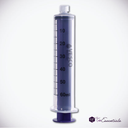 Reusable 60mL Enteral ENFit Syringe with a clear barrel, black graduation markings, and a purple plunger placed on a White Background. The TubiEssentials Logo is located in the bottom right corner.